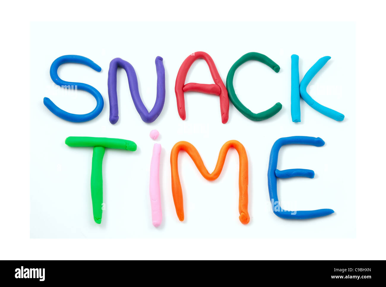 "Snack Time" spelled out using child's clay isolated on a white