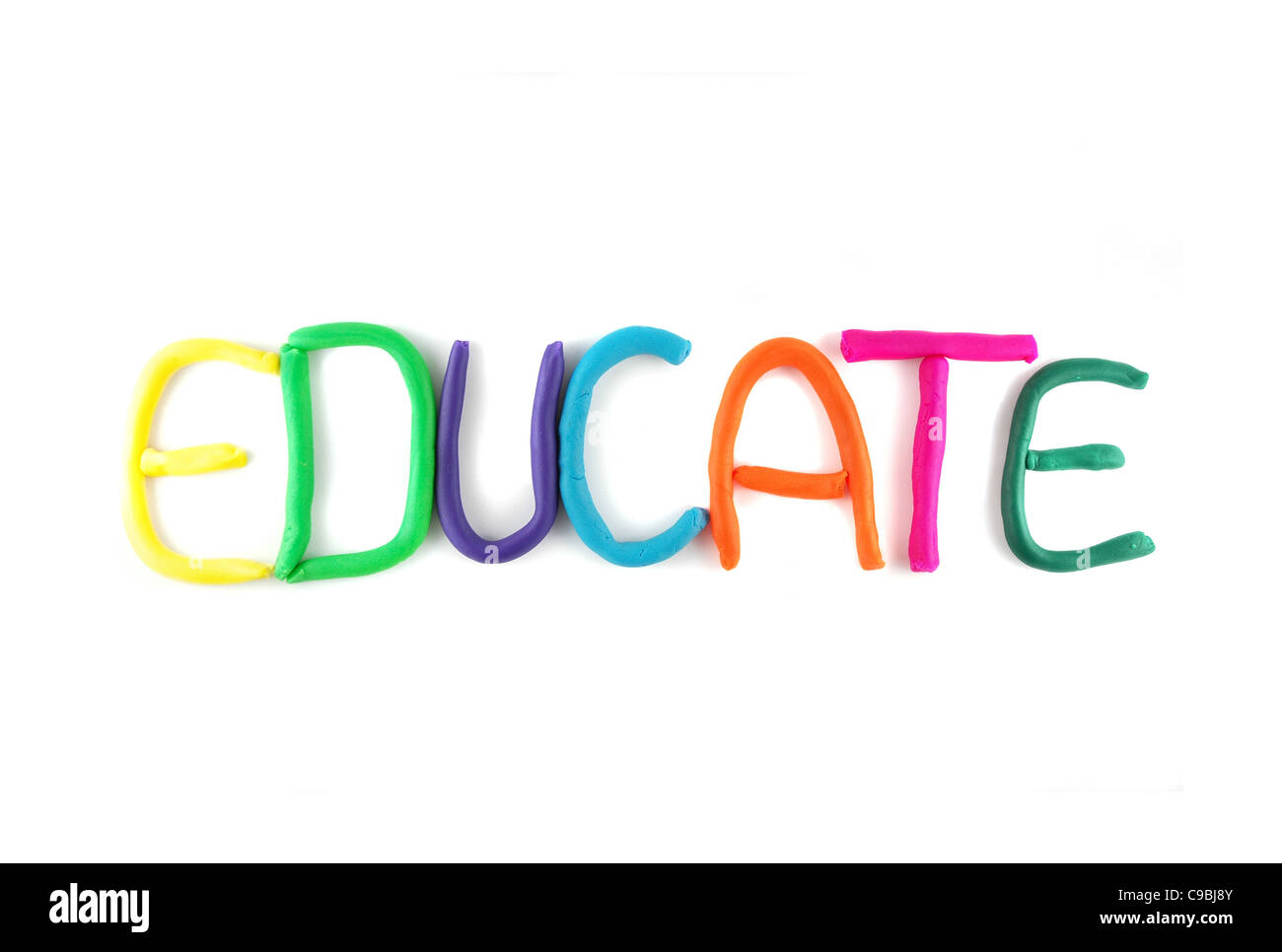 'Education' spelled out in child's clay isolated on white background Stock Photo