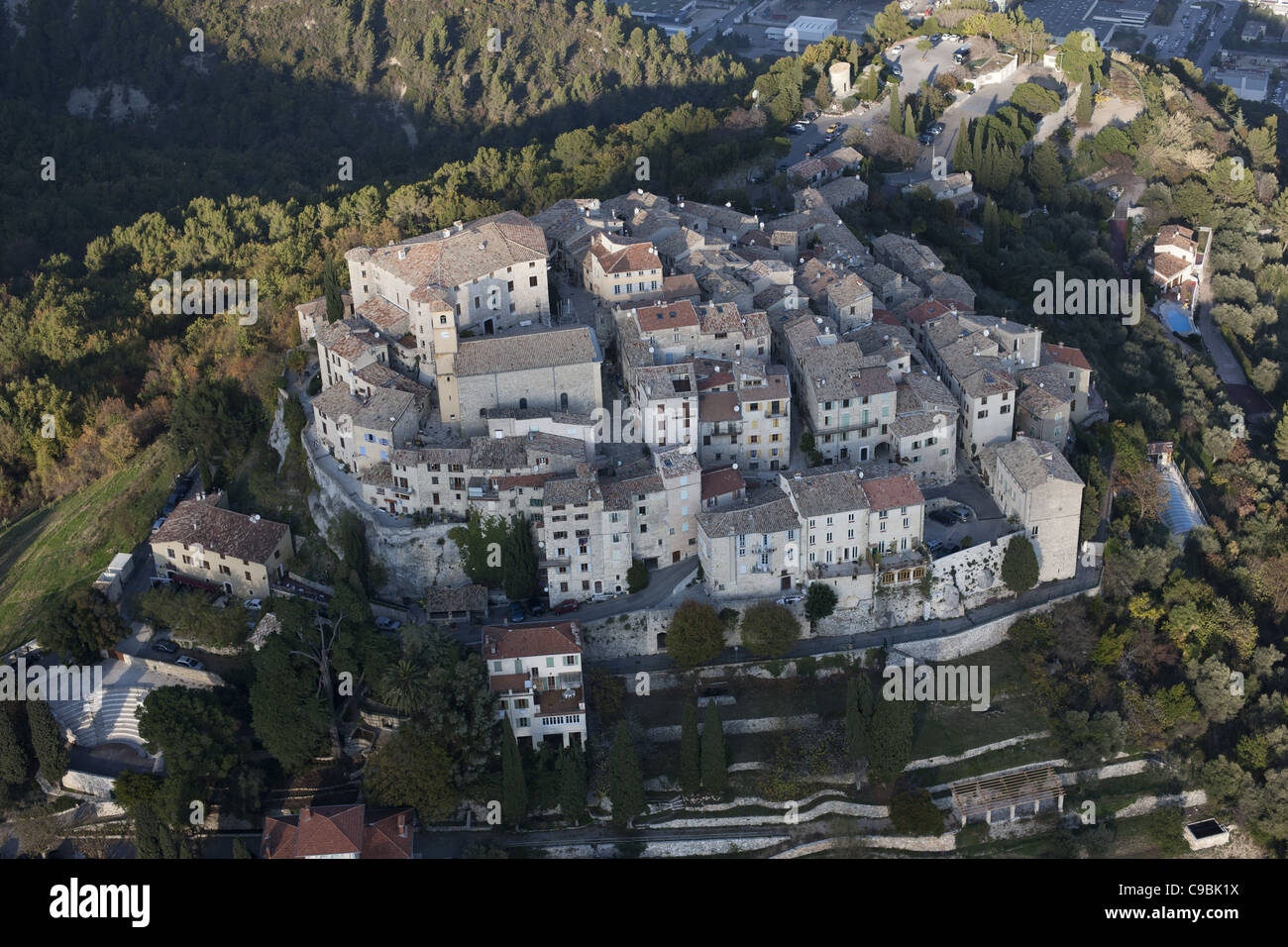 AERIAL VIEW. Perched medieval village of Carros. French Riviera, France. Stock Photo
