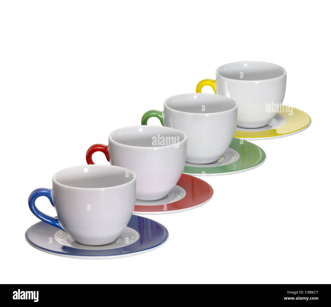 4 porcelain cups and saucers in a row, isolated on white with clipping
