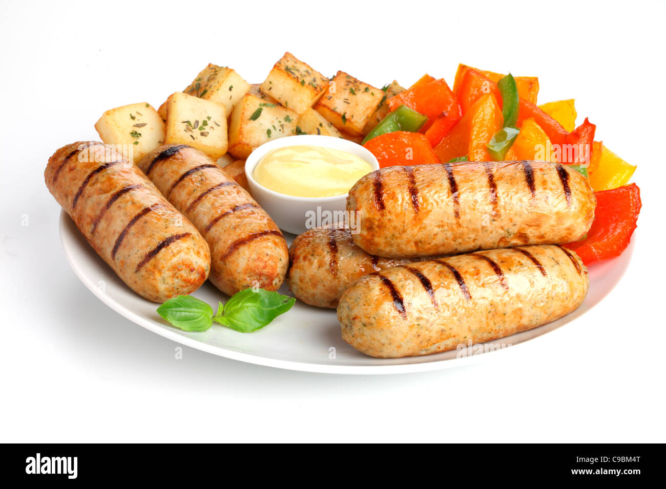 CHICKEN SAUSAGES WITH SAUTE POTATOES Stock Photo