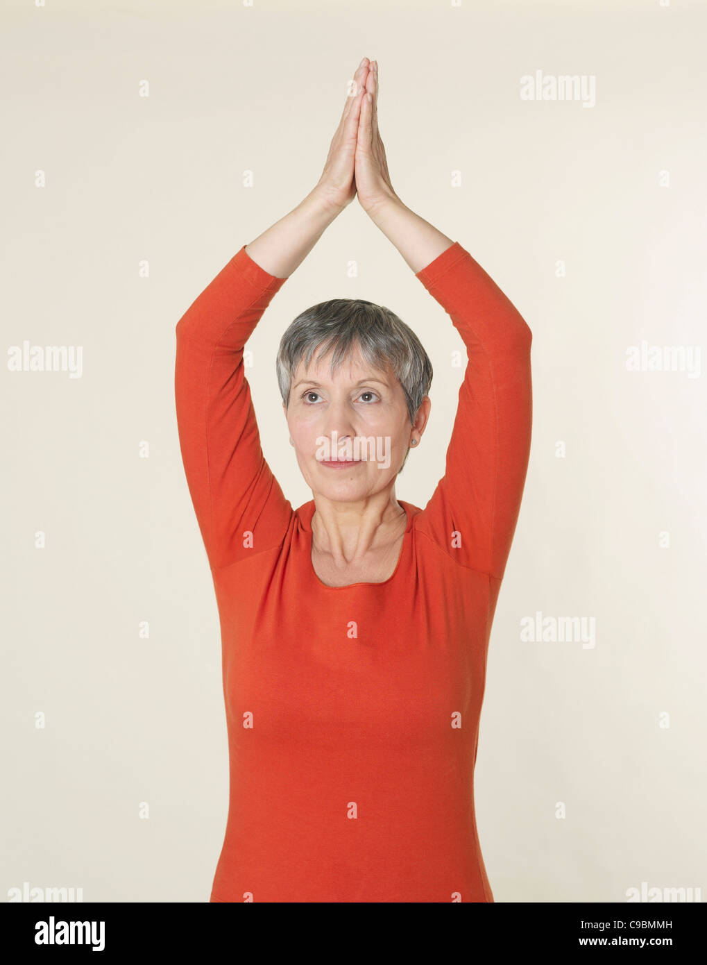 Senior Woman In Prayer Position Stock Photo Alamy