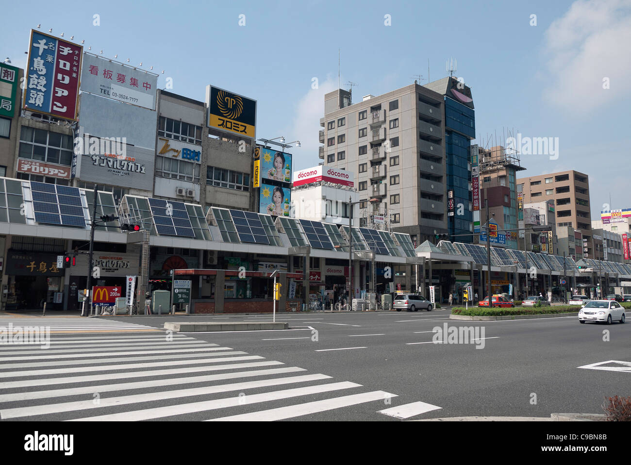 Japan, Honshu, Tokyo, Sugamo, the roof of arcade covering sidewalk used for solar electric and water heating panels. Stock Photo