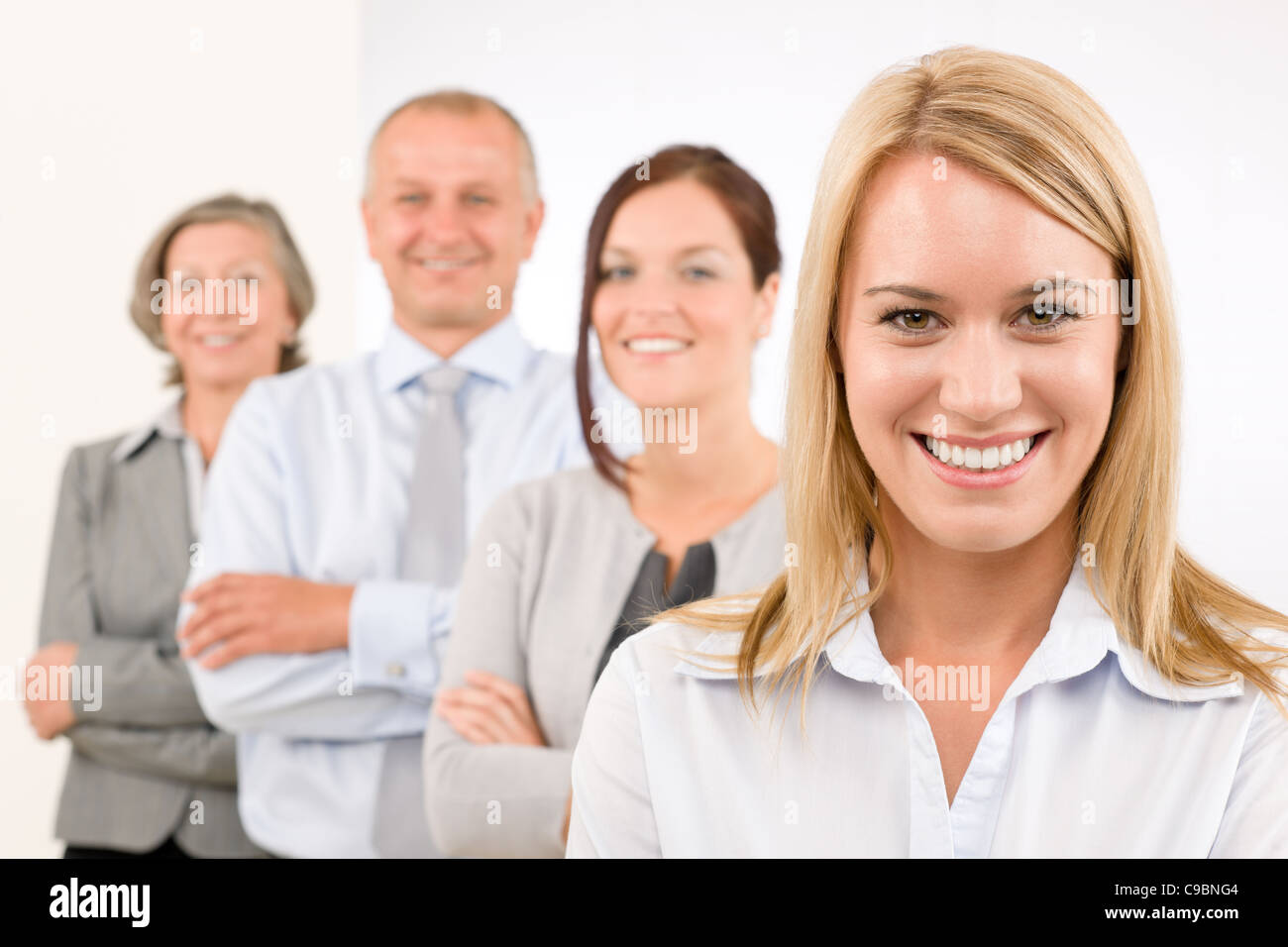 Business team happy attractive woman colleagues standing in line portrait Stock Photo