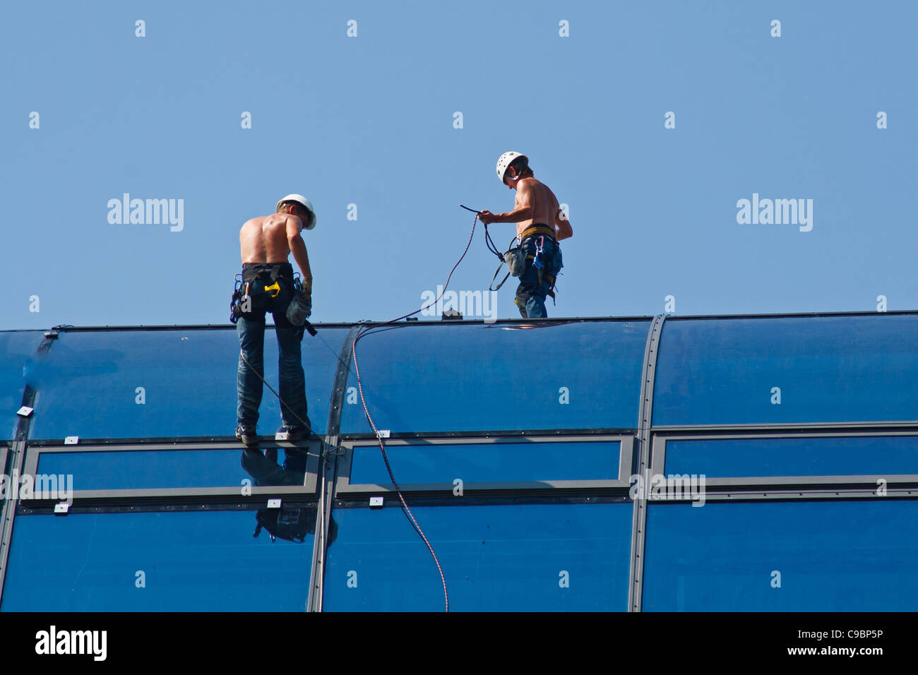 Work on a glass roof of Radisson Hotel. Berlin, Mitte, Germany. Stock Photo