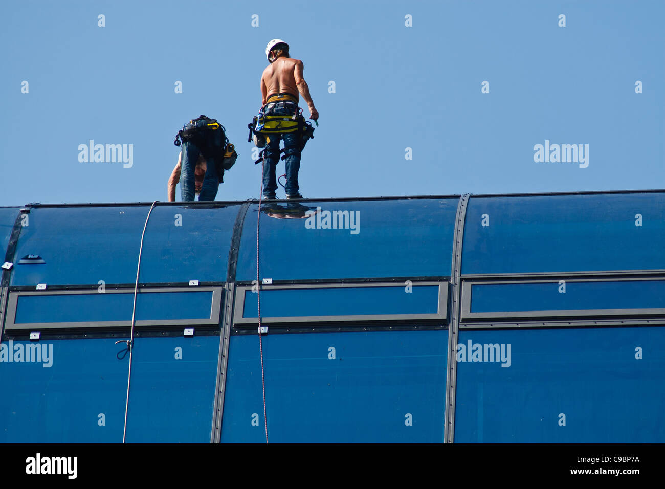 Work on a glass roof of Radisson Hotel. Berlin, Mitte, Germany. Stock Photo
