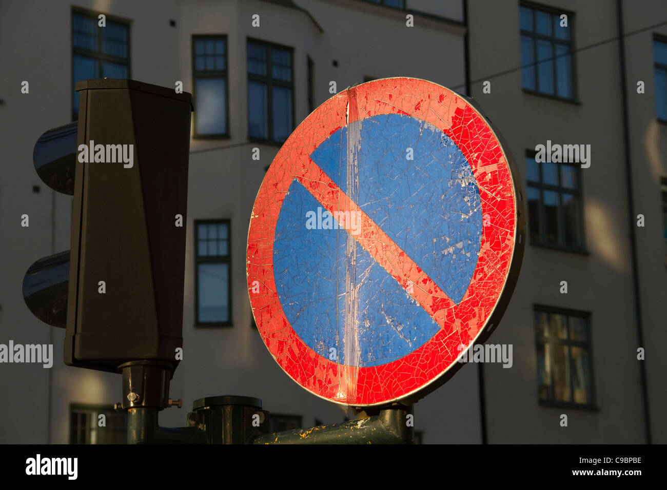 Old weathered round road sign in Stockholm Sweden Stock Photo