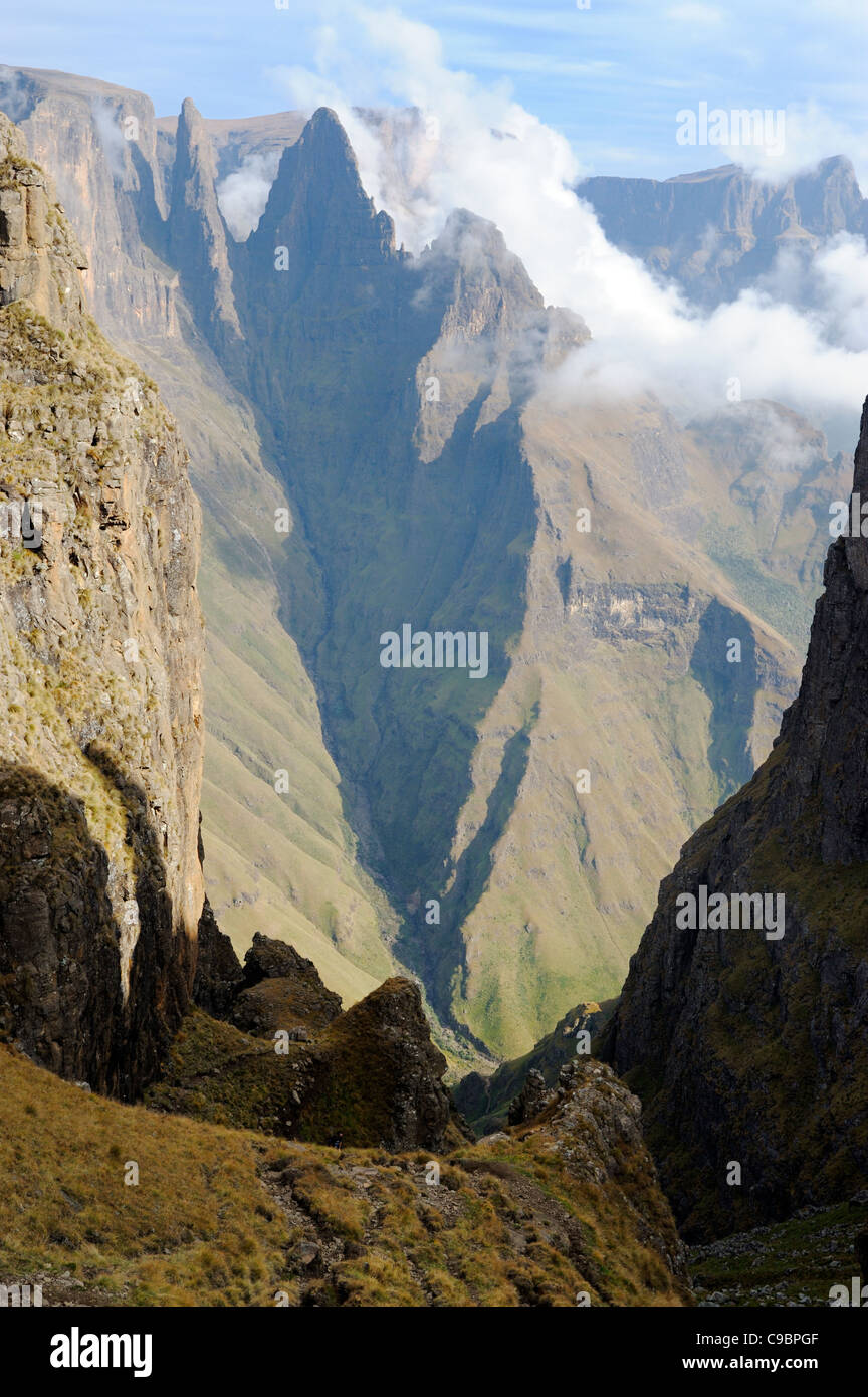Mountain Pass with sharp peak and low lying cloud in background, Mweni, Drakensberg, Kwazulu Natal, South Africa Stock Photo