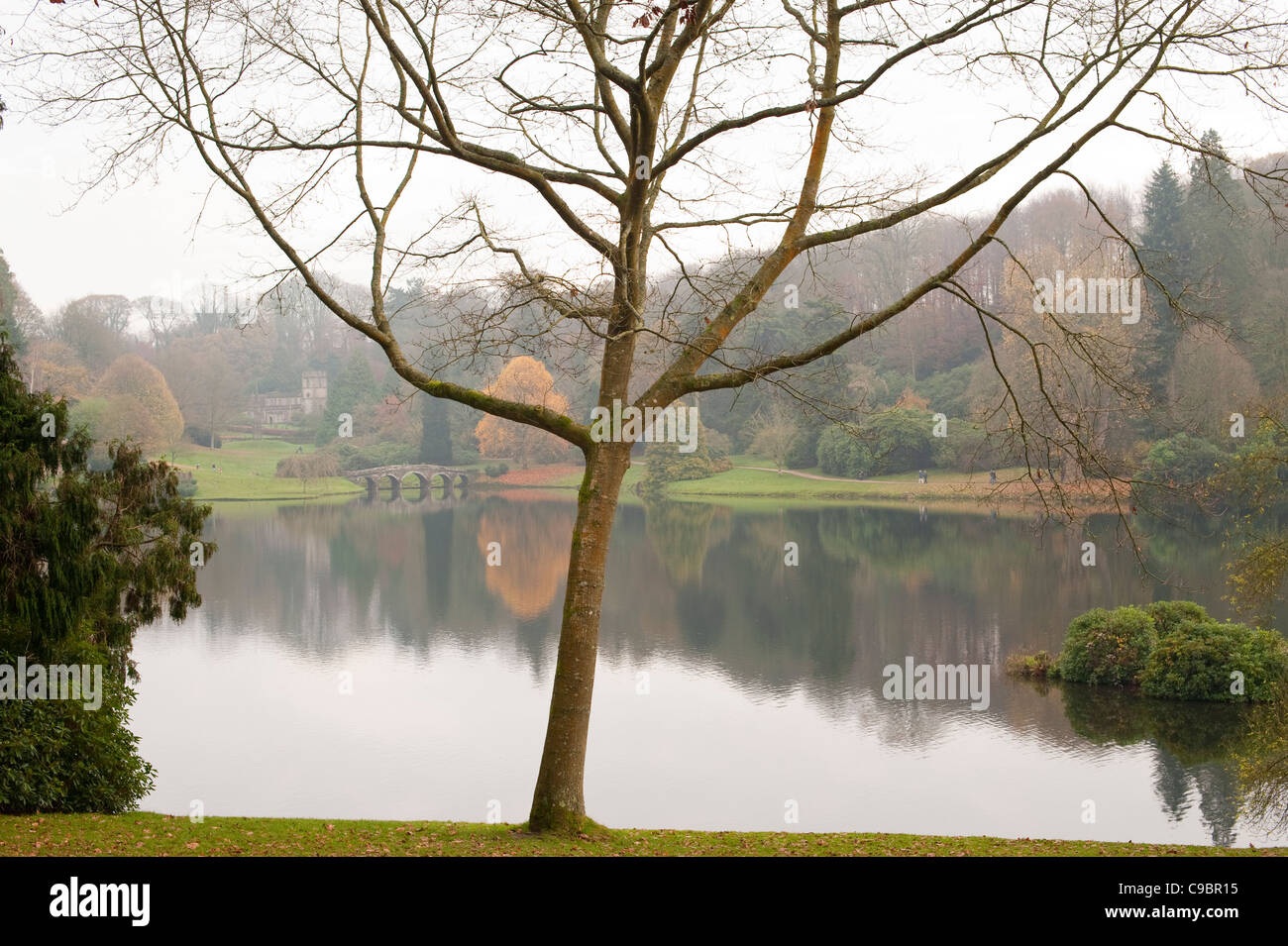 English lake in autumn with reflections of trees in the water Stock Photo