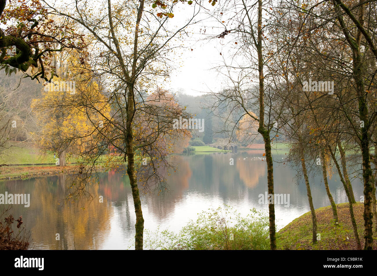 English lake in autumn with reflections of trees in the water Stock ...