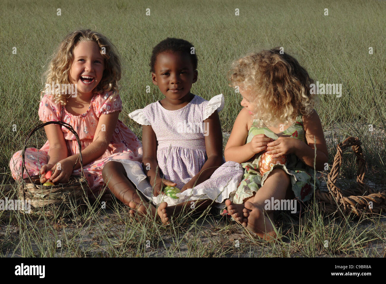Three girls playing with Easter Eggs, Grabouw, Cape Town, Western Cape