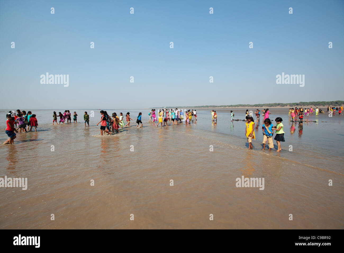 School trip to the beach of Dandi, where Mohandas Gandhi finished his Salt March in 1930. Gujarat state, India. Stock Photo