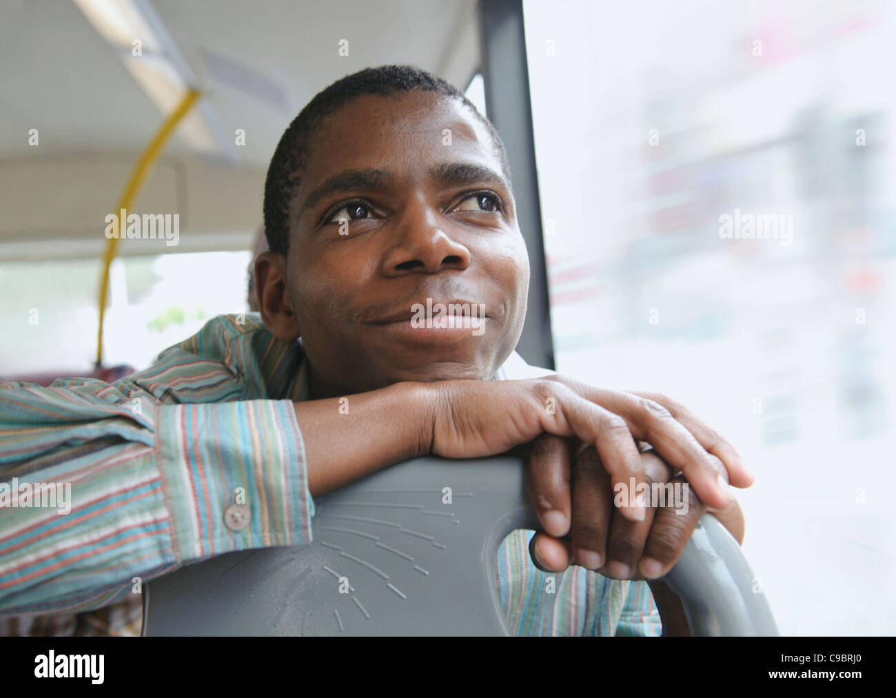 Man daydreaming, on bus, Cape Town, Western Cape Province, South Africa Stock Photo