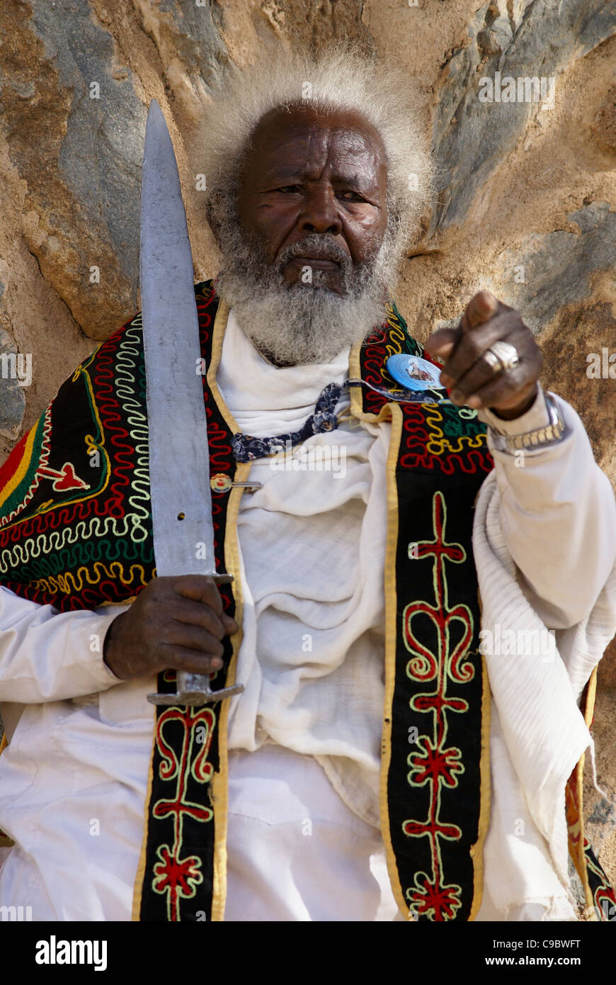 Portrait of an Ethiopian senior man brandishing a sword during Timket, the Ethiopian Orthodox celebration of Epiphany, Stock Photo