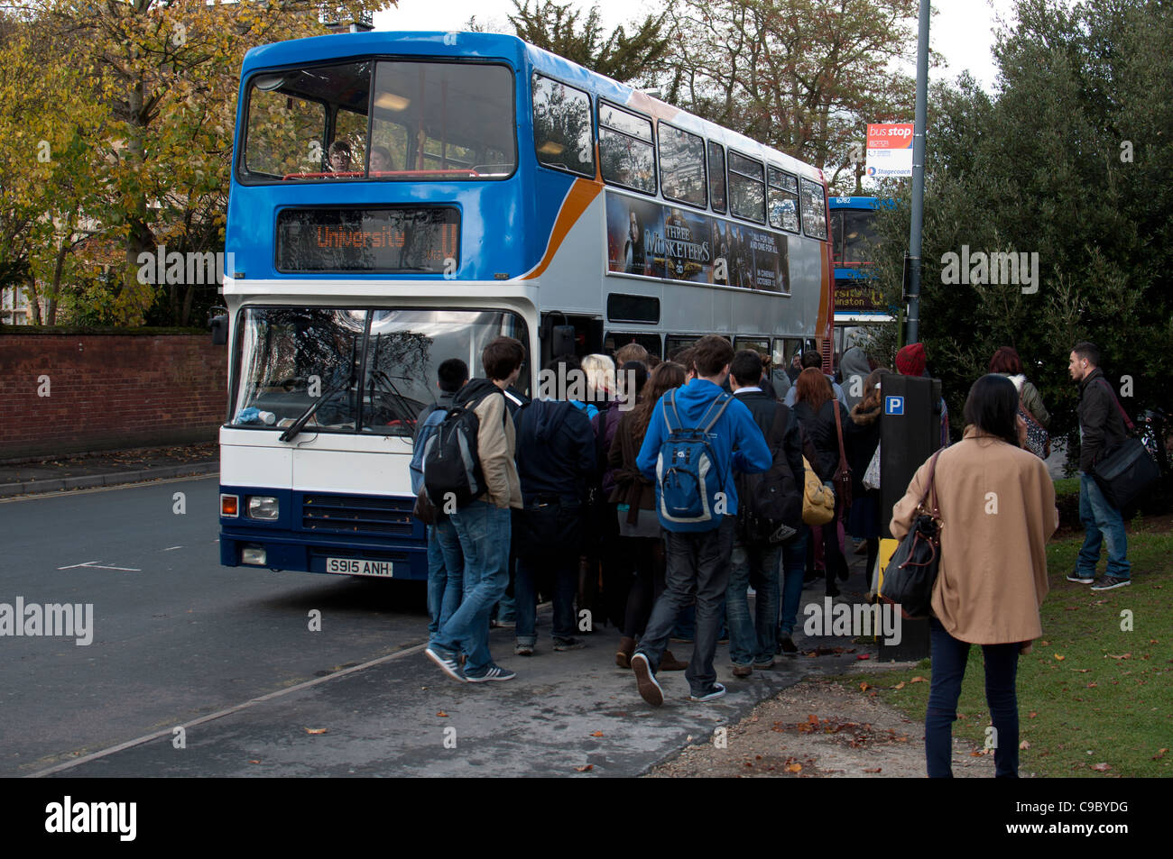 Students catching Warwick University bus, Leamington Spa, UK Stock Photo Alamy
