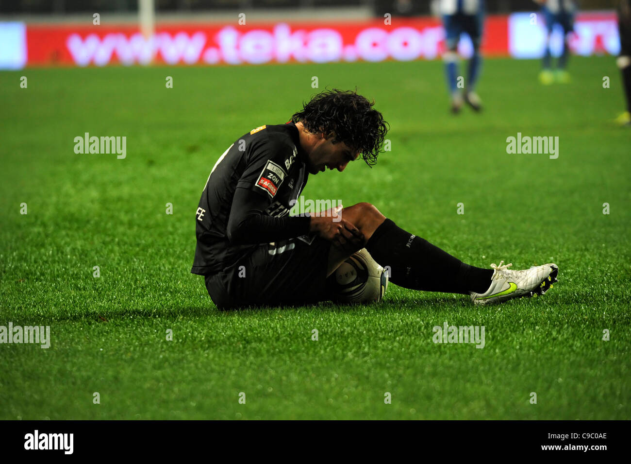 Football player with knee injury Stock Photo