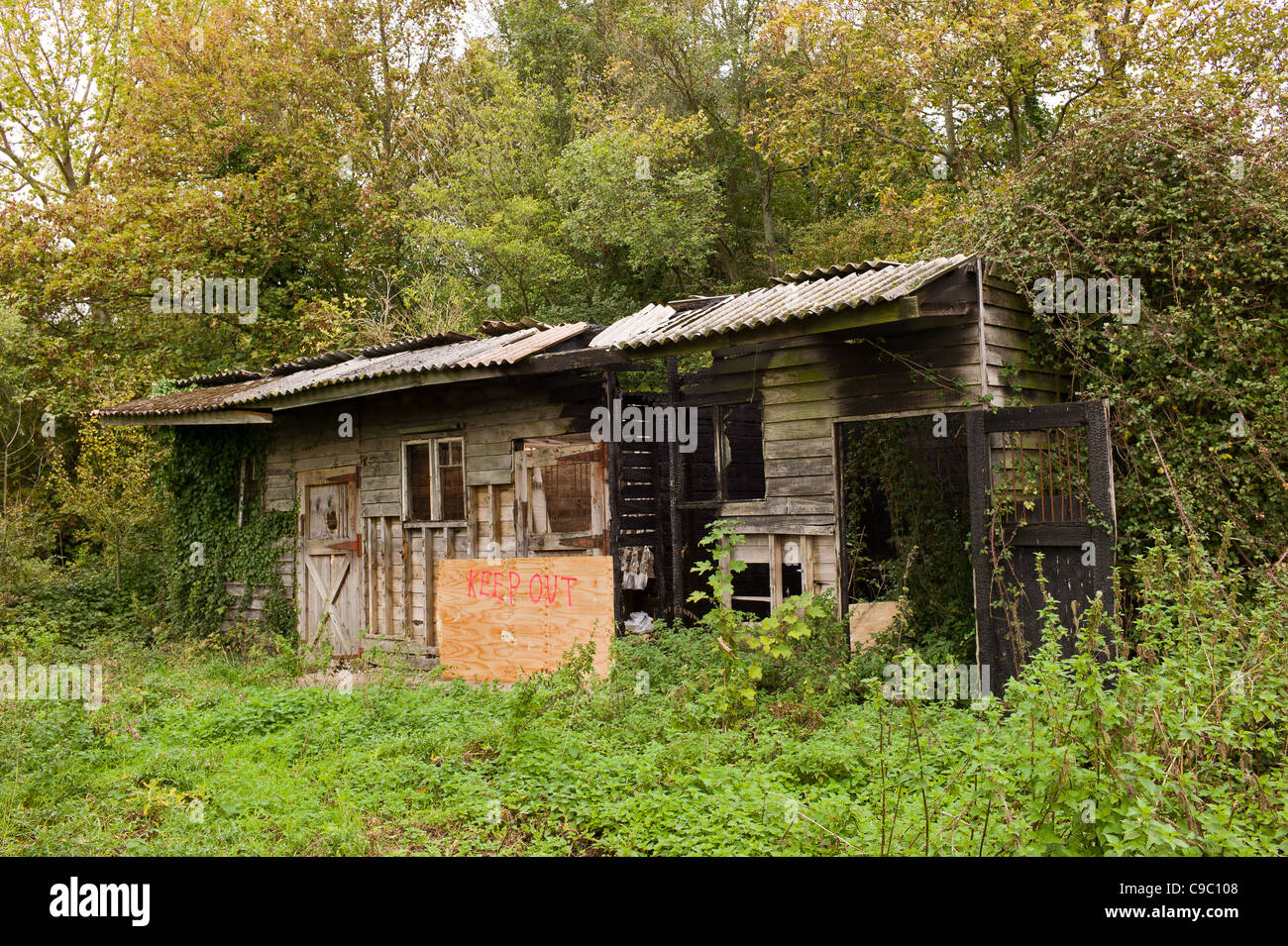 Tumbledown burnt out cabin Arundel West Sussex Stock Photo