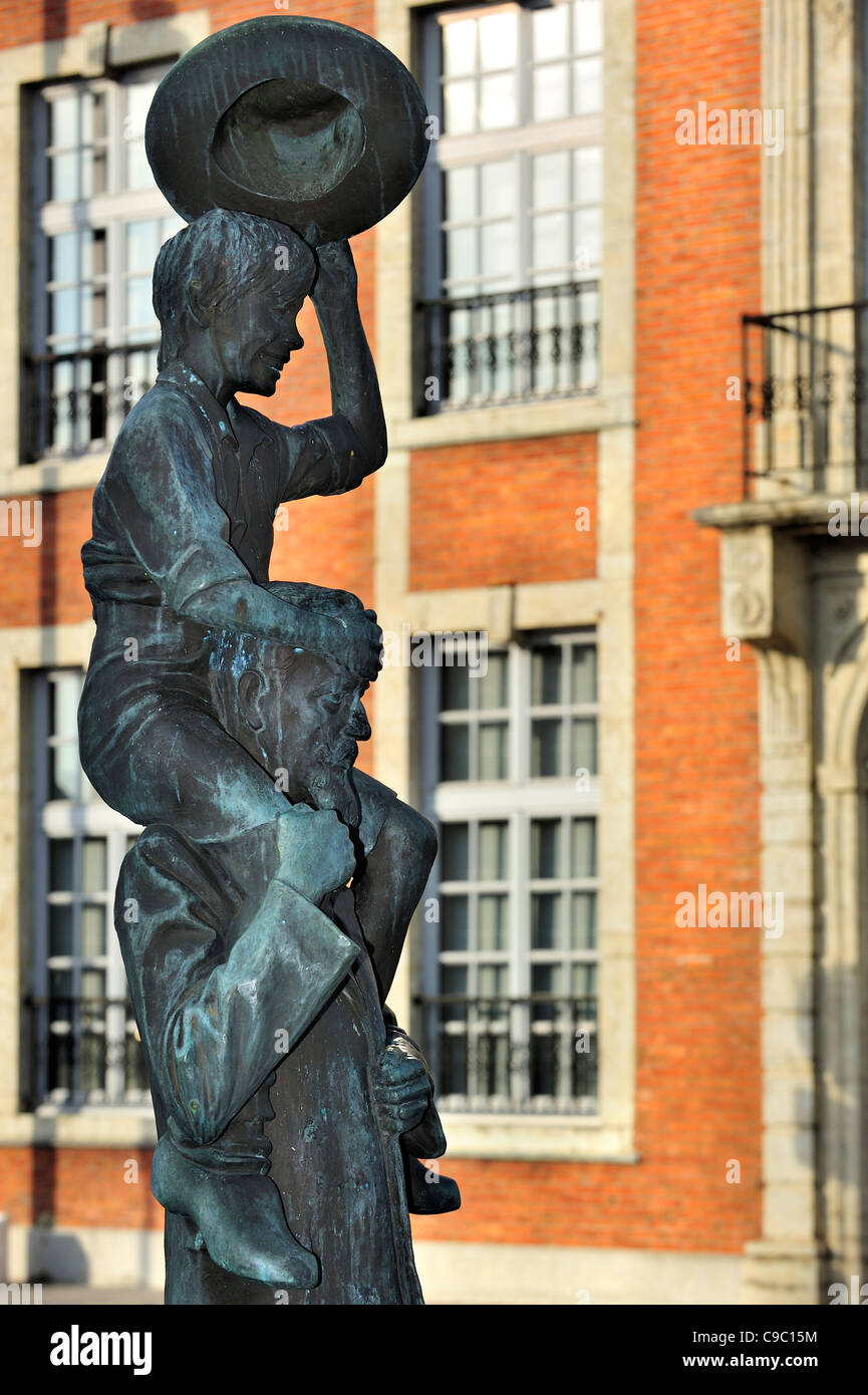 Statue of Ernest Claes with on his shoulders the character De Witte van Zichem, Belgium Stock Photo