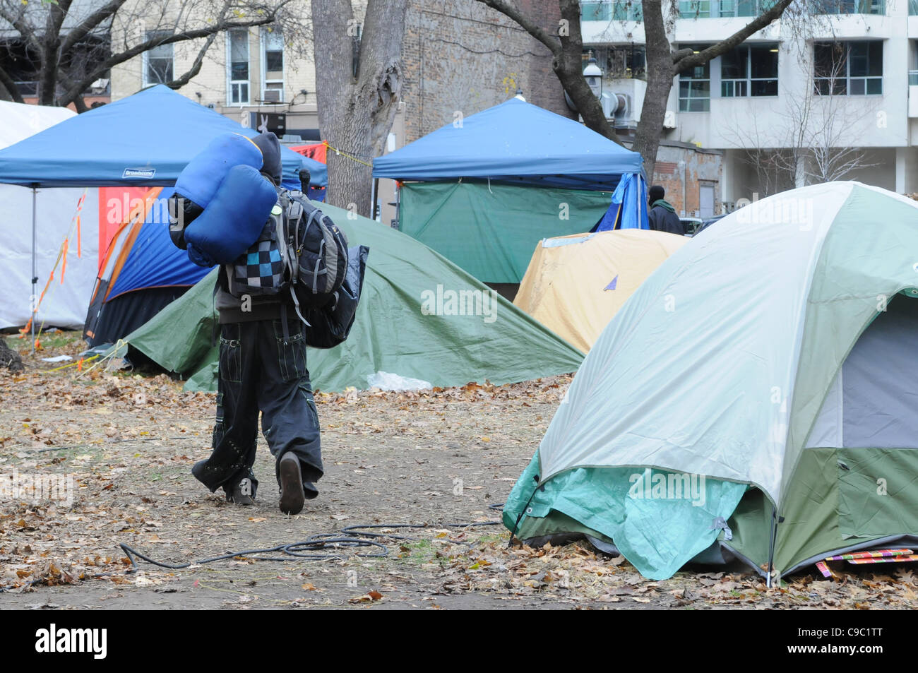 November 21, 2011, one unidentified protester packed up and vacating St. James park following the decision handed down this morning by Ontario Superior Court judge David Brown, upholding the Occupy Toronto tent camp eviction. Stock Photo