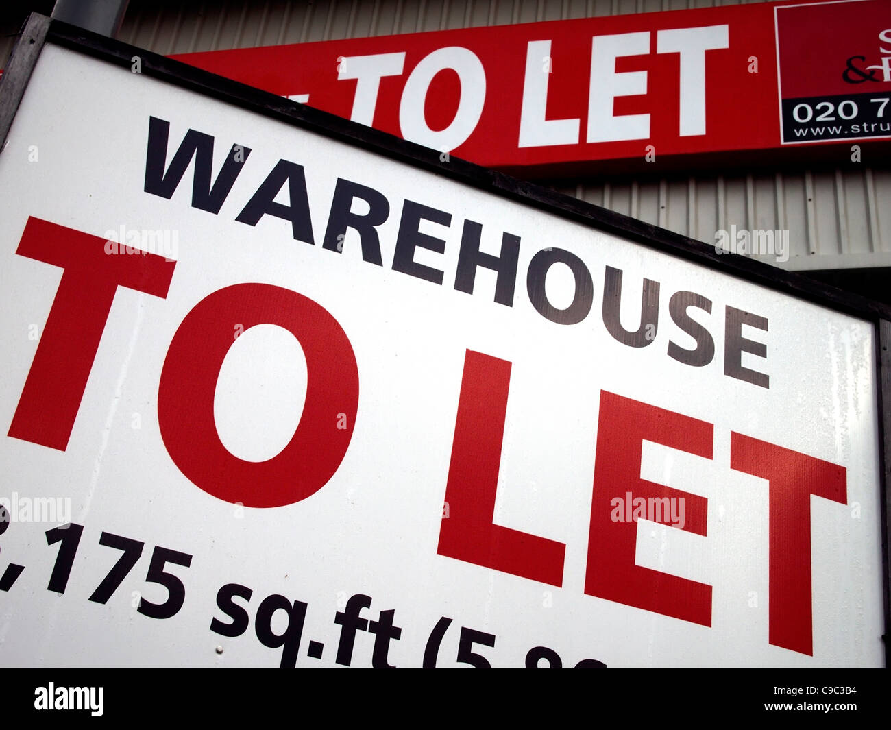 'To-let' signs outside a warehouse in England. Stock Photo