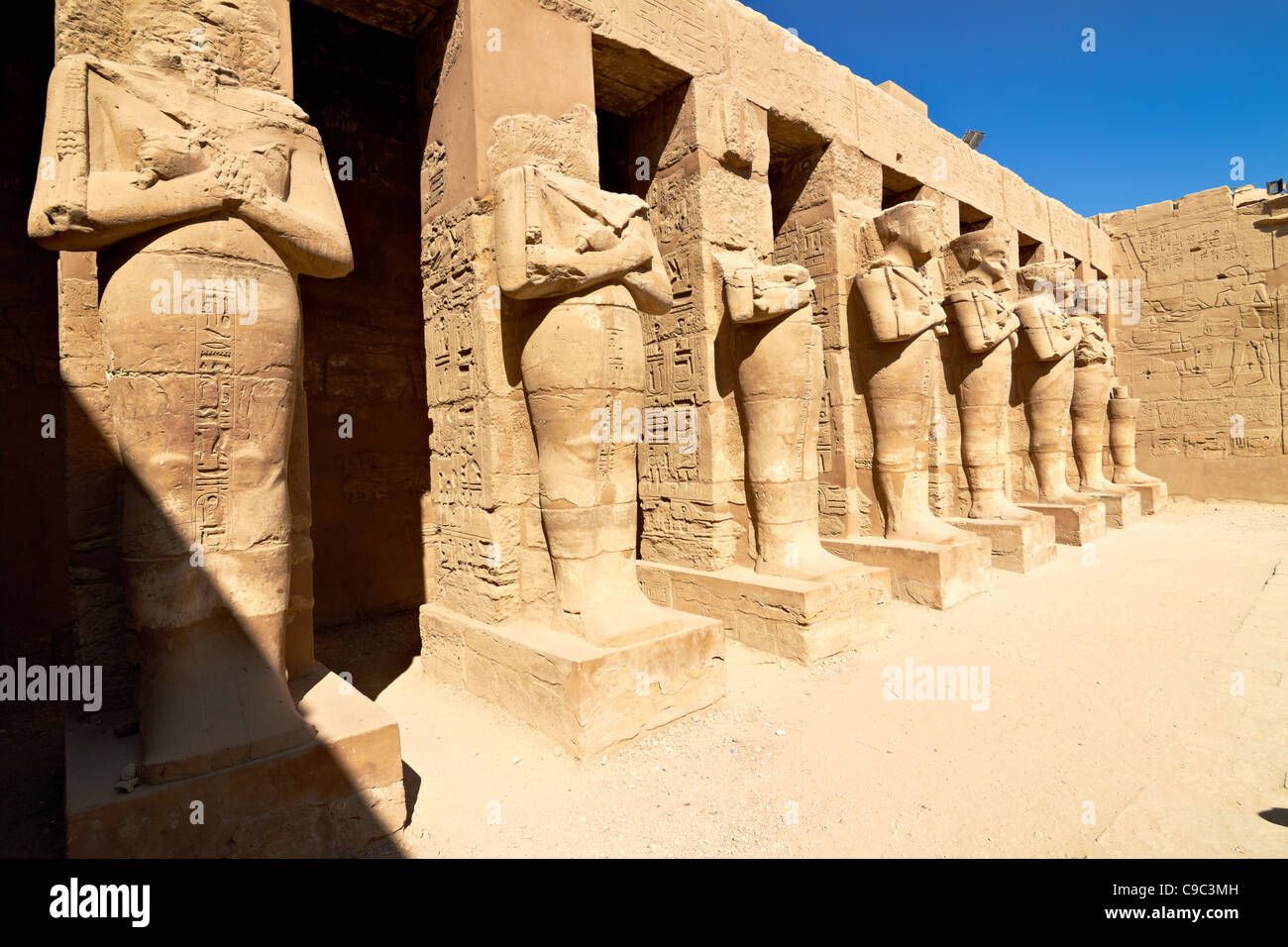 Linear perspective of Pharaoh statues in Karnak temple, Egypt Stock