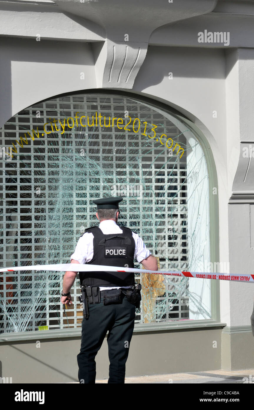 PSNI officer at the scene of a bomb blast at the City of Culture 2013 offices in Londonderry, Northern Ireland. Stock Photo