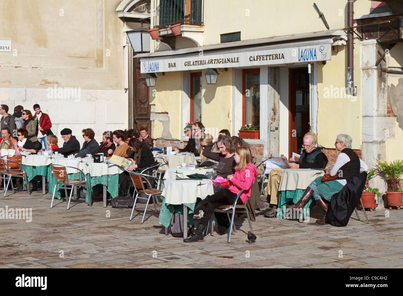 Tourists sat at an outdoor cafeteria bar, Venice, Italy, Europe. Stock Photo