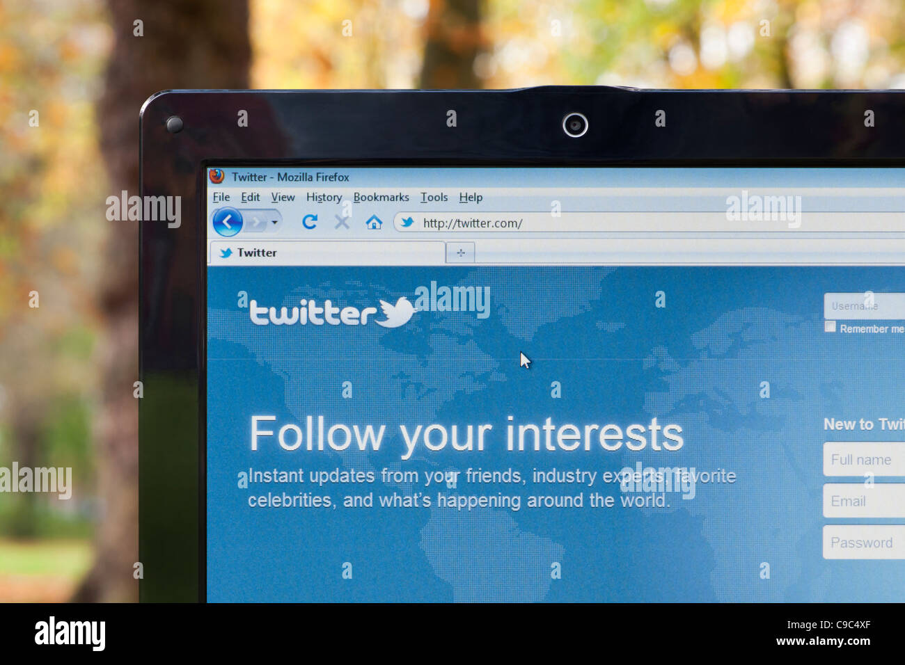 The Twitter website shot in park environment (Editorial use only: print, TV, e-book and editorial website). Stock Photo