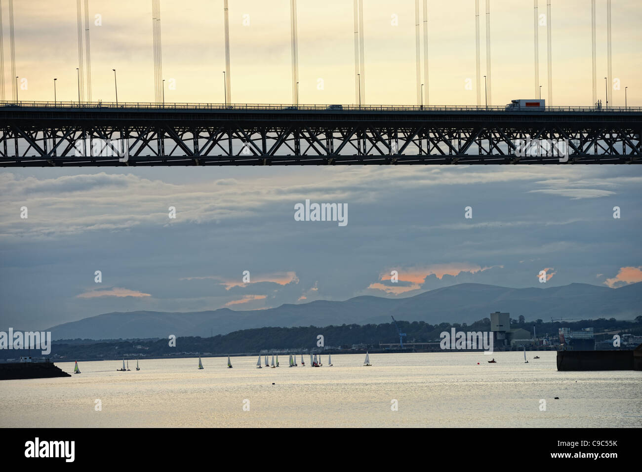 Sailing out of Port Edgar, Firth of Forth, by the Forth Road Bridge, Scotland, UK, Europe, at sundown Stock Photo
