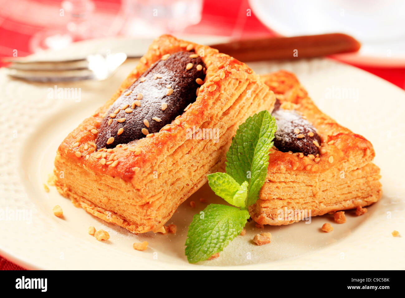 Chocolate filled puff pastry tart shell sprinkled with sesame seeds Stock Photo Alamy