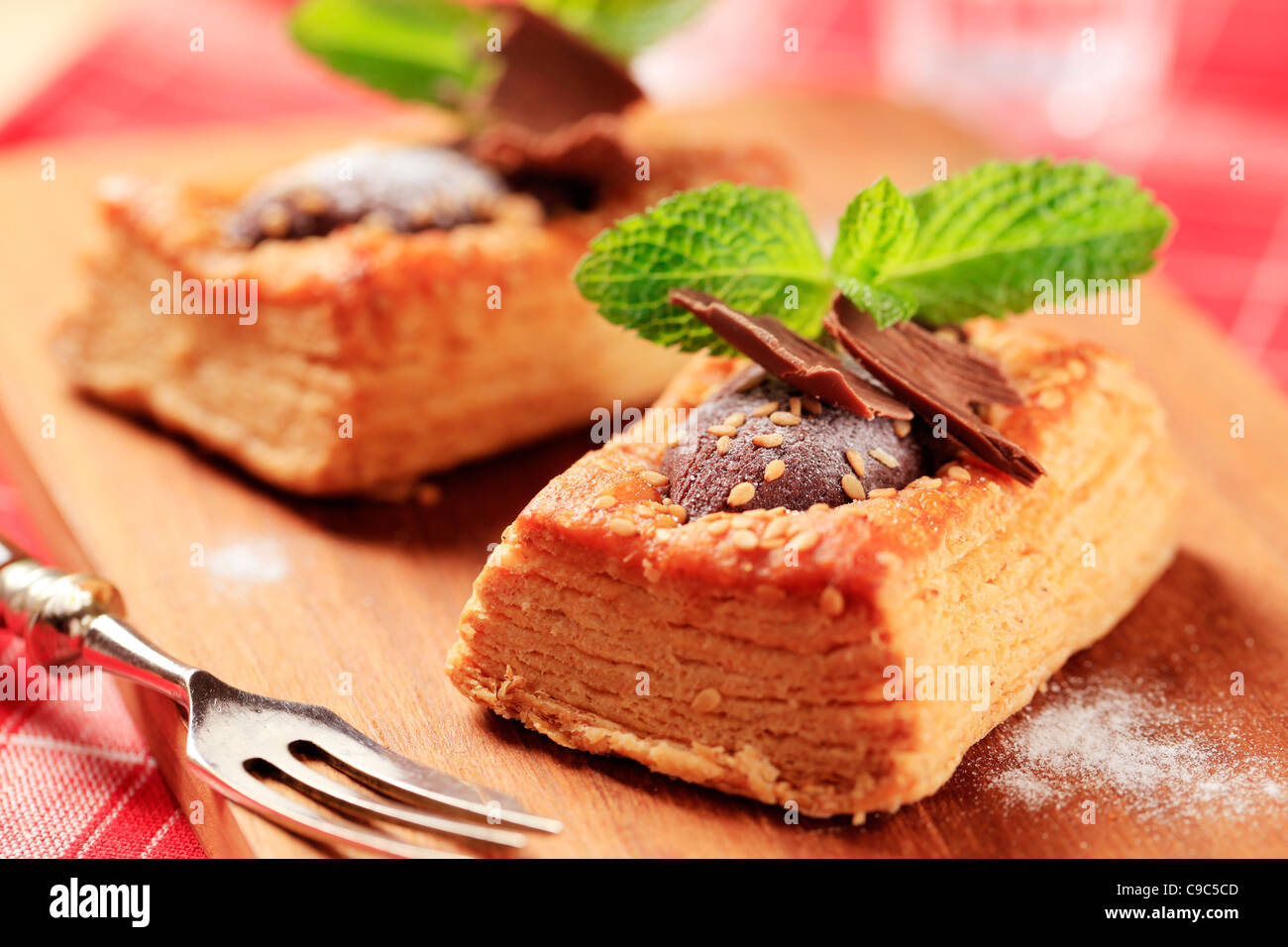 Chocolate filled puff pastry tart shell sprinkled with sesame seeds Stock Photo Alamy