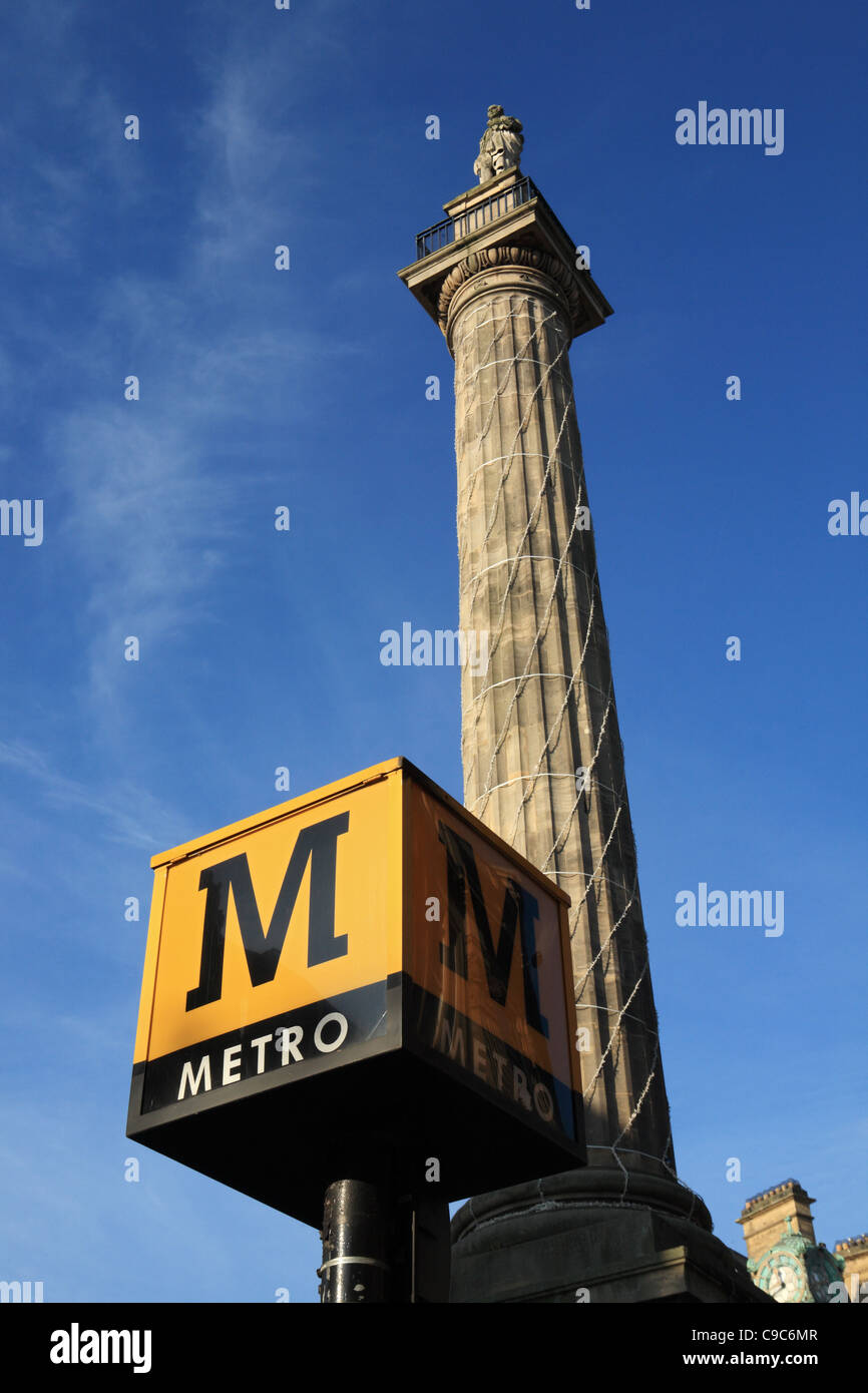 Tyne and Wear Metro sign with Grey's monument in the background, Newcastle, north east England, UK Stock Photo