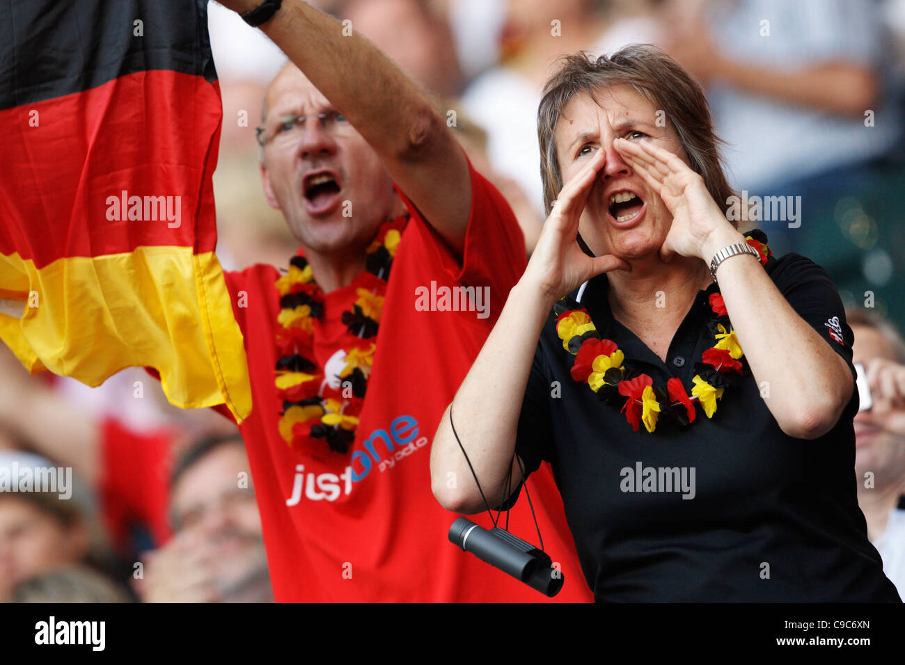 Germany supporters cheer their team at the 2011 FIFA Women's World Cup Group A match between France and Germany. Stock Photo