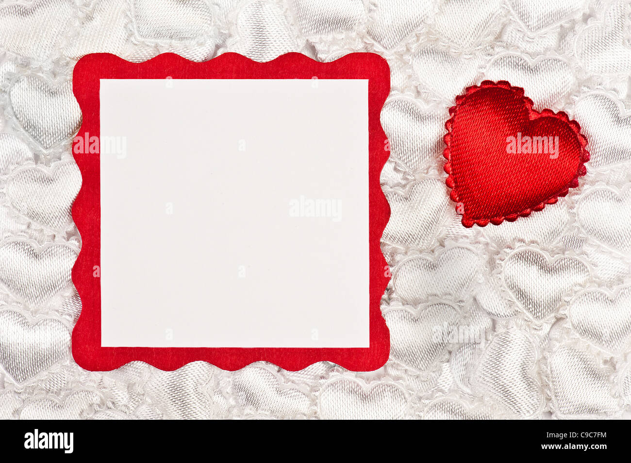 Red heart on white hearts with a note card Stock Photo - Alamy