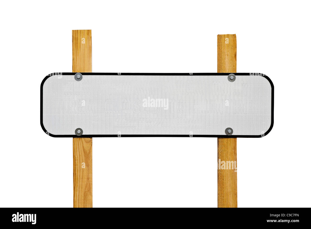 Blank reflective highway message sign on wooden posts. Stock Photo