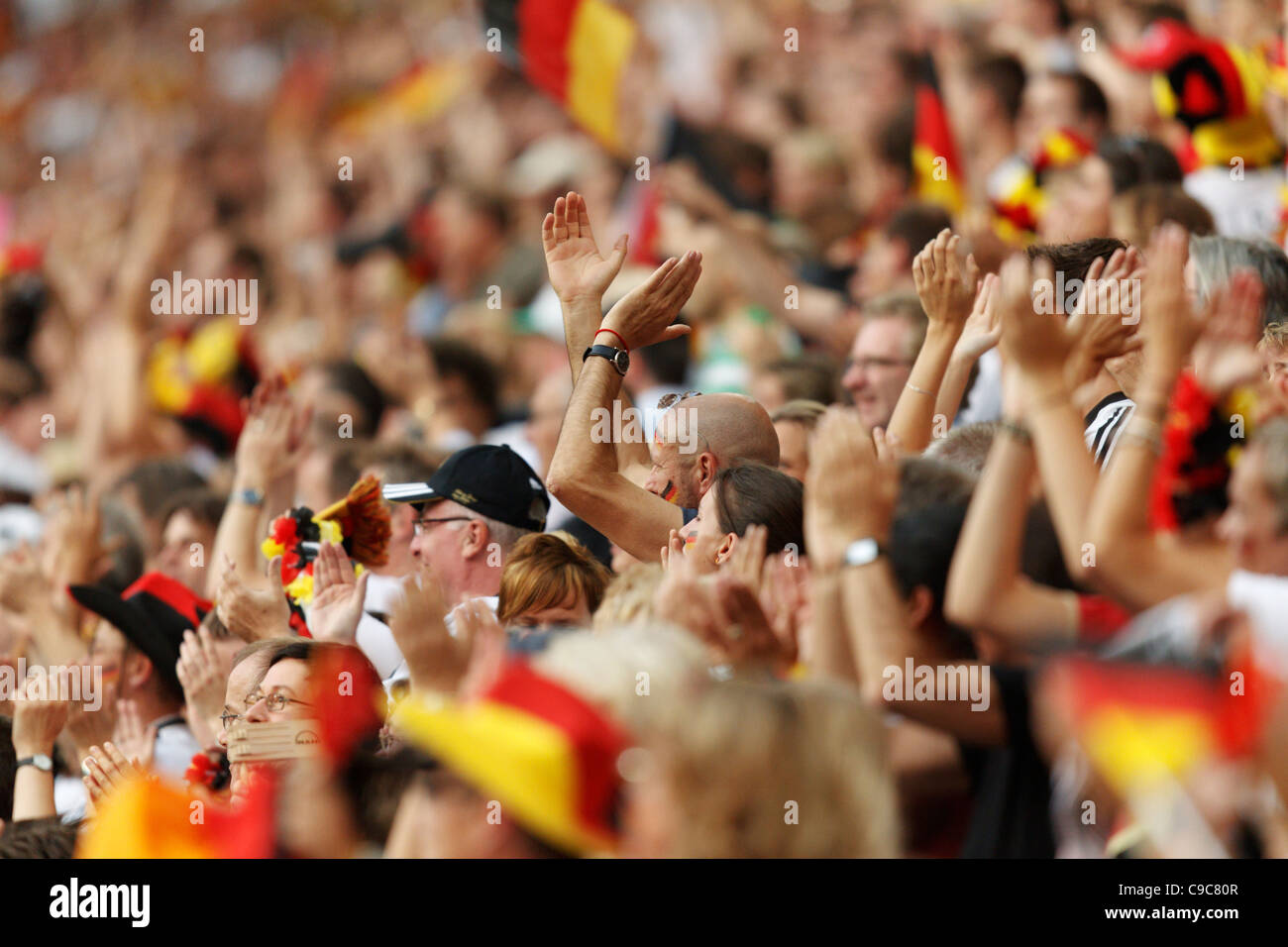 Germany supporters clap during a 2011 Women's World Cup Group A match between France and Germany at Stadion im Borussia Park Stock Photo