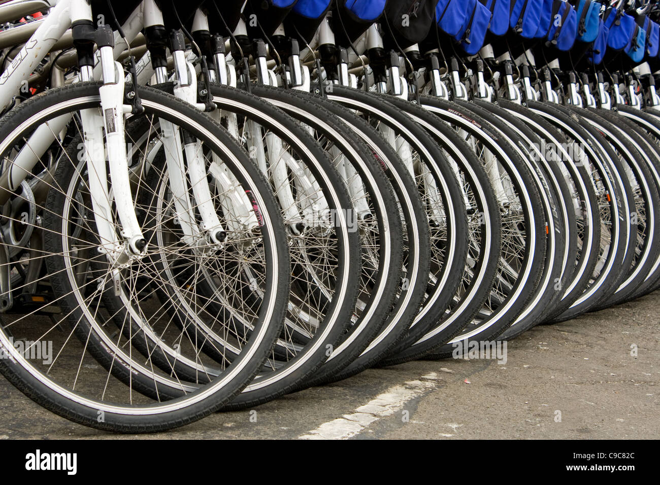 Several mountain bikes lined up on a street ready to be used by tourist in San Fransisco close to the Piers Stock Photo