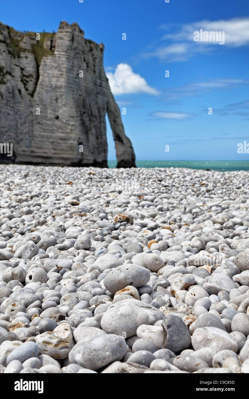 Image of the rocky beach and iconic natural arch from Etretat in Upper Normandy in North of France. Stock Photo