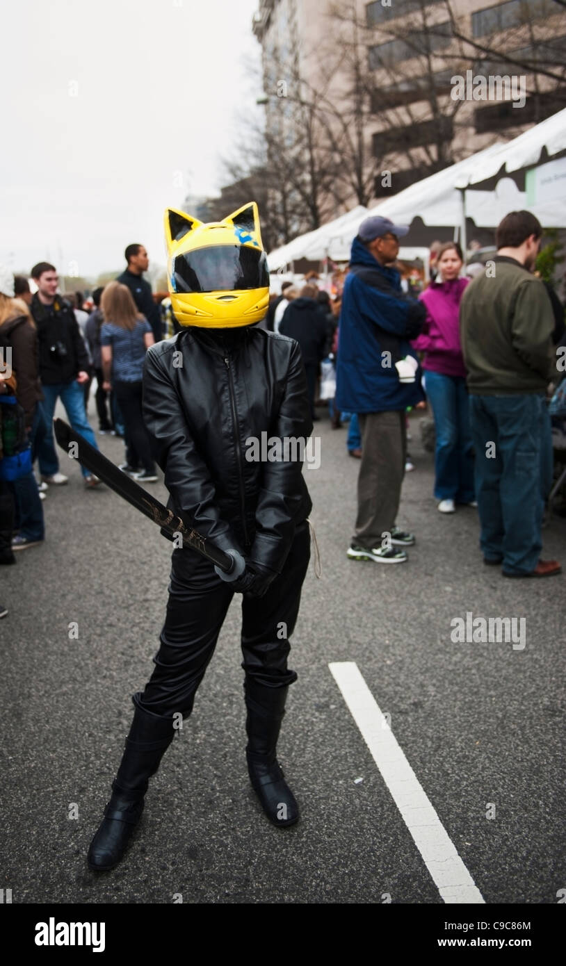 Leather suited biker samurai costumed performer holding a sword on the streets of Washington DC Stock Photo