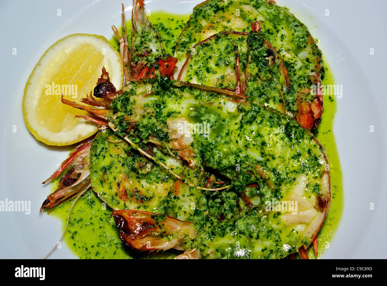 Jumbo prawns half shell in chopped basil parsley garlic butter sauce