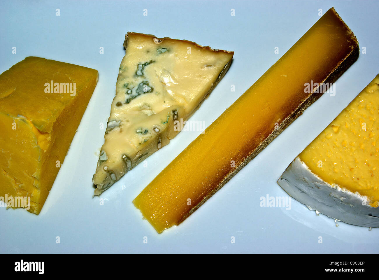 Wedges aged New Zealand cheddar, hard French cheese, and soft ripe