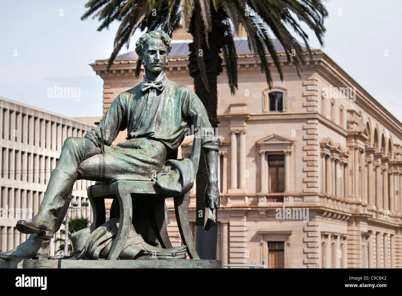 Adam Lindsay Gordon bronze statue with The old Treasury Building in background,Melbourne Australia. Stock Photo