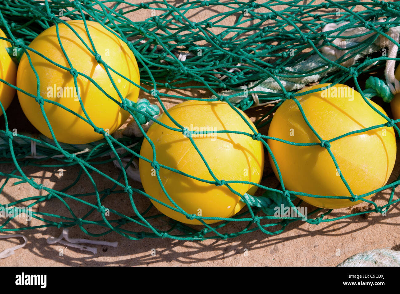 fishing nets woth yellow buoy in Mediterranean Balearic port Stock Photo