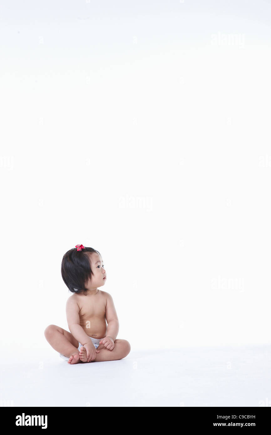 Baby girl in nappy Stock Photo Alamy