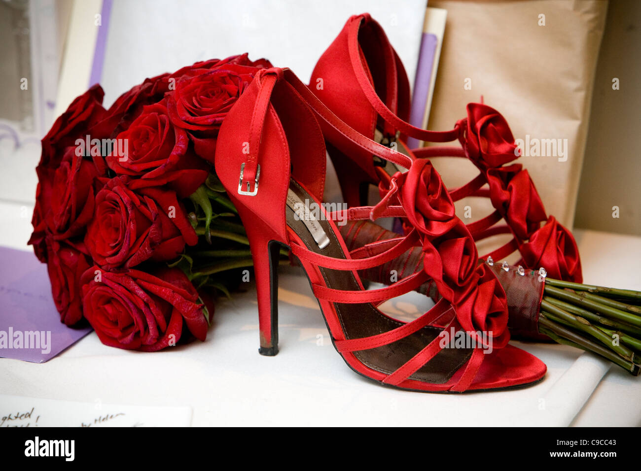 Red wedding shoes with red roses and 