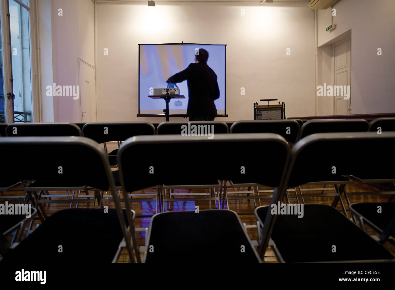 Person preparing overhead projector in conference room Stock Photo Alamy