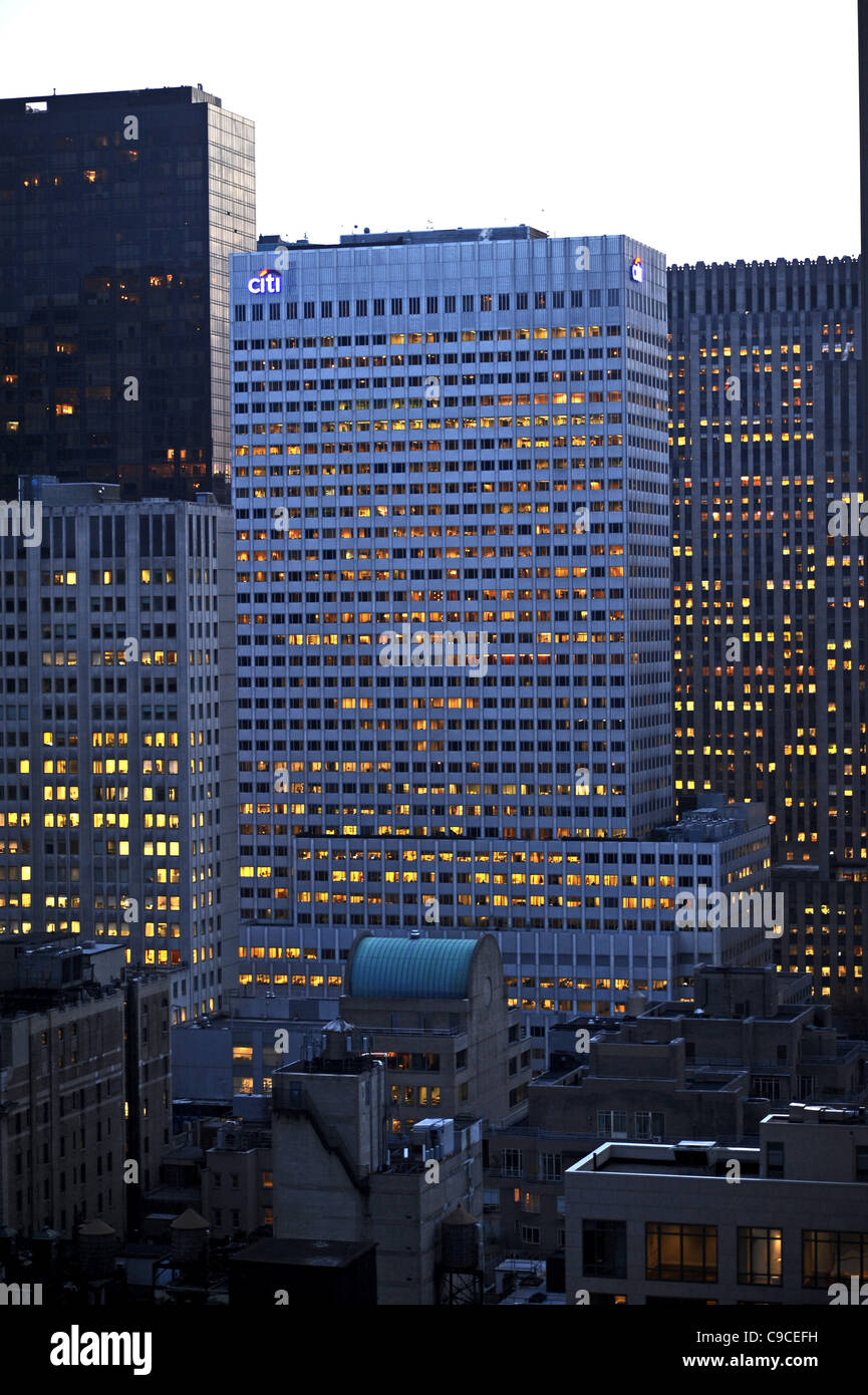 Tower block offices lit up at night near Central Park Manhattan New York NYC USA America Stock Photo