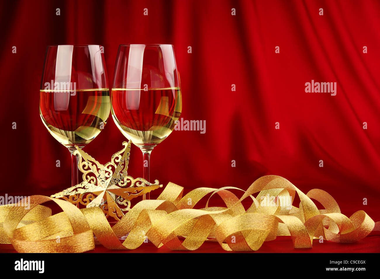 Glasses of champagne with golden ribbon. Stock Photo