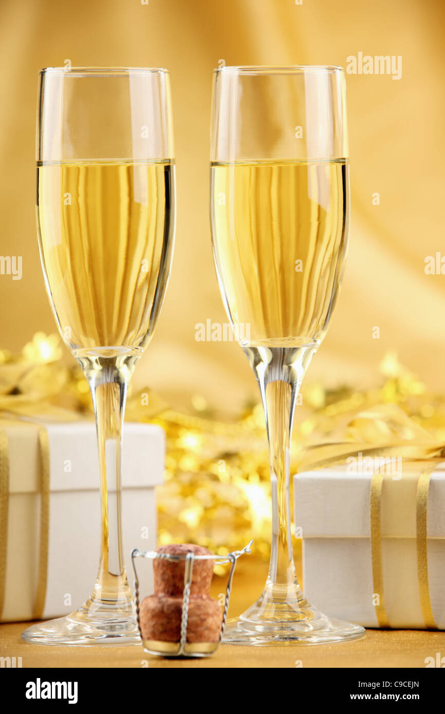 Glasses of champagne with gift boxes. Stock Photo