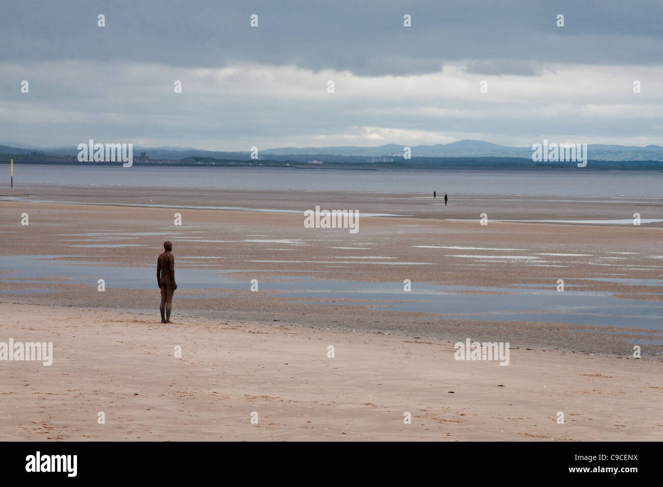 Crosby beach near Liverpool, Merseyside, UK, with figures from Anthony Gormley's work 'Another